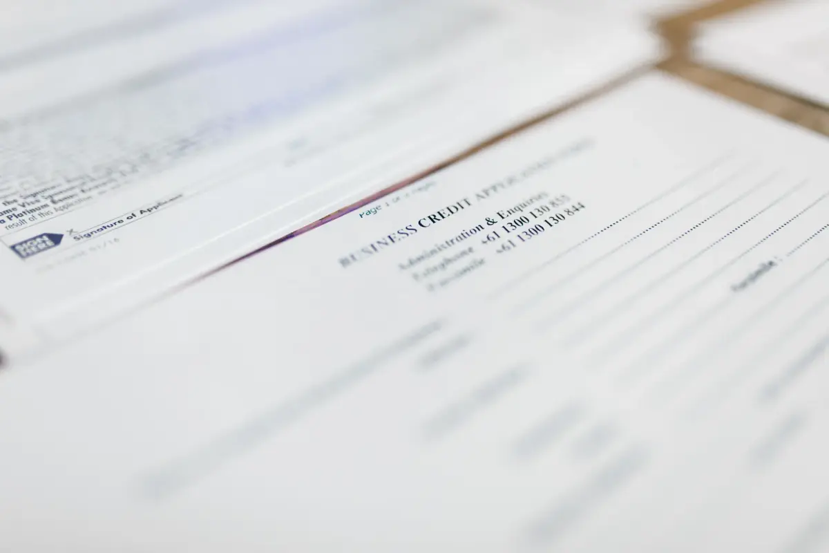 Focused image of business credit application papers, ideal for finance themes.